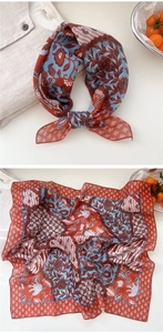 Close-up of vintage floral print linen-cotton scarf with silk-like sheen and boho patterns