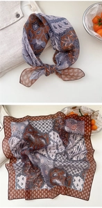Detail of cotton linen scarf with vintage batik print and wavy scalloped edge detail