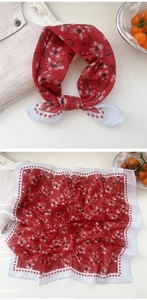 Detail of red floral cotton linen scarf with soft pattern and vintage aesthetic texture