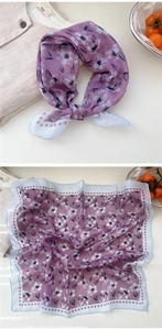 Detail of light purple floral linen scarf with breathable fabric and elegant patterns