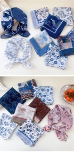 Detail of assorted floral cotton linen scarves featuring delicate patterns and soft texture