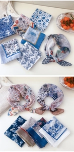 Detailed macro shot of vintage floral cotton linen scarves with diverse retro printed patterns