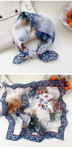 Close-up of vintage navy cotton linen floral scarf with elegant flower pattern texture