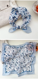 Detail of floral cotton linen neck scarf with blue leaves and red berry botanical print