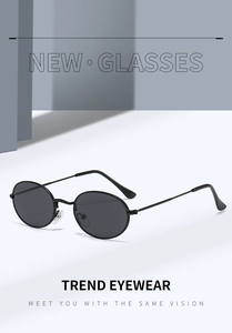Close-up of vintage oval metal sunglasses featuring non-slip tips and soft silicone nose pads