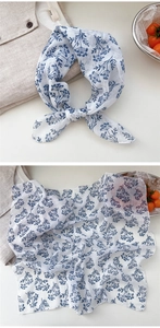 Detail of floral cotton linen scarf showing breathable texture and blue vintage pattern