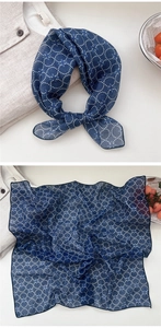 Detail of floral navy blue cotton linen square scarf with white polka dot patterns