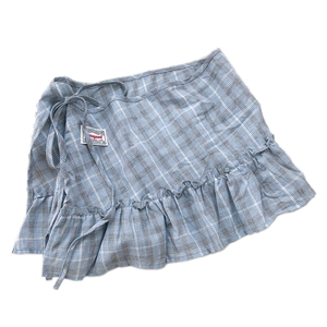 Blue-grey plaid wrap skirt with ruffle hem and waist tie for layered fashion looks
