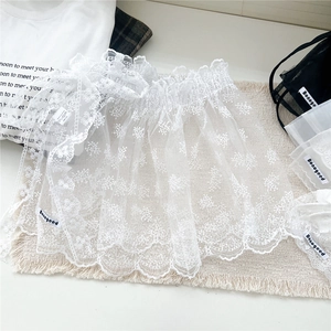 White lace layered mini skirt with floral embroidery for stylish layering outfits