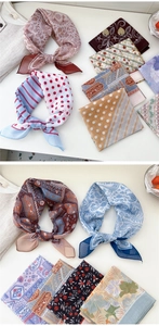 Detailed view of floral vintage square scarves in various retro patterns and colors
