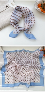 Detail view of floral vintage silk scarf featuring blue stripes and brown polka dots pattern