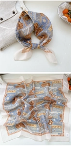 Detail view of Bohemian floral silk scarf with vintage geometric pattern tied on neck