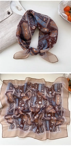 Close-up of vintage paisley square scarf with geometric patterns and silk-like texture