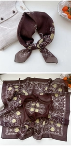 Detailed view of dark brown floral square scarf with strawberry print on white linen