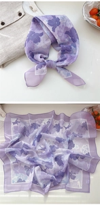 Detail of floral purple silk scarf showing light texture and elegant knotted style