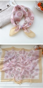 Detail of pink floral square scarf with champagne border and translucent chiffon texture