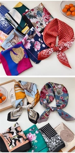 Detail showing various floral and geometric patterns on satin silk square scarves