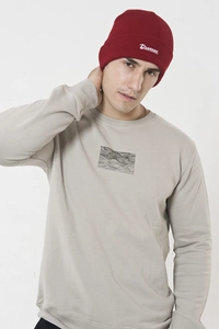 Detail of grey sweatshirt with burgundy knit hat featuring Drunnen white embroidery
