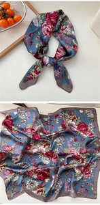 Detailed view of floral silk neckerchief with elegant rose print and gray blue tones