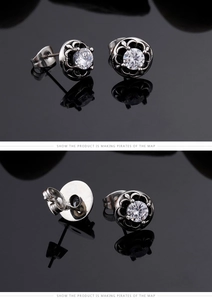 Detail of retro titanium steel stud earring with cross pattern and zircon stone