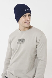 Detail view of Drunken letter embroidery on a dark blue knitted beanie for winter