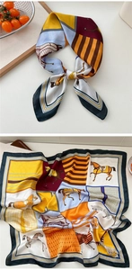 Detail showing colorful horse print silk scarf with equestrian patterns and stripes