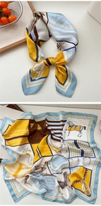 Detailed equestrian print silk scarf showing horses and geometric patterns in rich colors