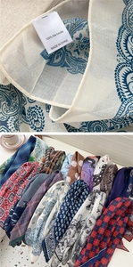 Detail of silk handle scarf showing 100% material tag and breathable fabric texture