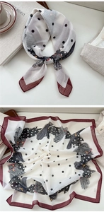 Close-up of silk scarf featuring polka dots and houndstooth patterns for styling