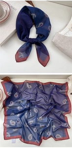 Detail of navy and burgundy paisley silk scarf with 100% silk handle and printed label