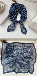 Detail of navy blue floral square scarf showing delicate fabric texture and vintage pattern