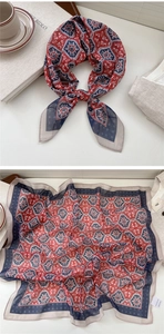 Detail of red and blue bohemian geometric square scarf tied on a handle and flat lay
