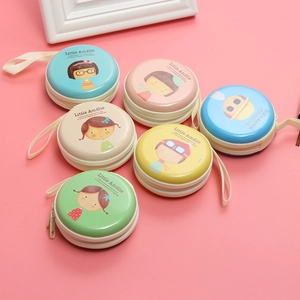 Collection of colorful round cartoon tinplate coin purses with zippers on pink background