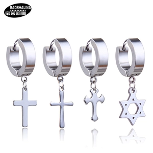 Detail view of four stainless steel hoop earrings with cross and star charms