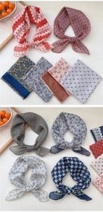 Detail of floral and geometric cotton linen scarves in various vintage patterns