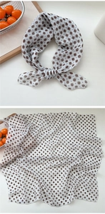 Detailed view of floral cotton linen neck scarf with blue flowers and stitched edges
