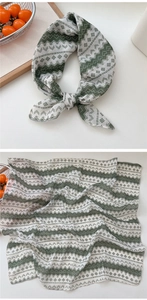 Close-up of green and white geometric pattern on soft cotton linen neck scarf