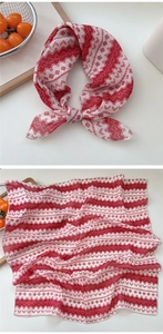 Detail of red and white geometric pattern printed on lightweight square cotton scarf