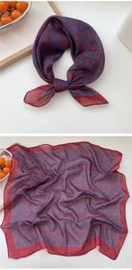 Detail of burgundy and blue palm leaf pattern on lightweight square neck scarf