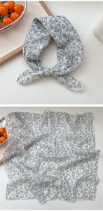 Detail of floral linen square scarf showing flat texture and elegant bow knot style