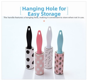 Close-up of portable lint rollers in four colors with various stylish patterned papers