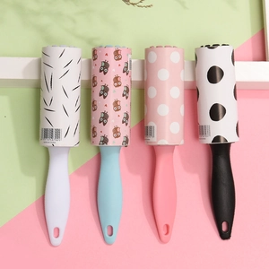 Portable lint rollers with four colorful patterned sticky paper refills for clothes cleaning