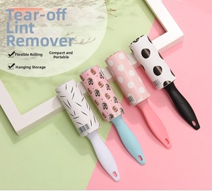 Detail of colorful mini lint rollers with patterned adhesive paper and hanging handles