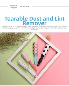 Close-up of portable lint rollers with ergonomic handles and patterned adhesive sheets