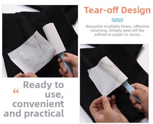 Close-up of portable lint roller removing dust from black fabric with peel-off adhesive paper