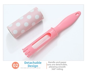 Detail of pink lint roller with detachable handle and 360-degree rotating refill