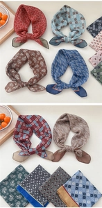 Close-up of assorted cotton linen scarves with geometric and paisley patterns