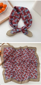 Detail of soft cotton linen square scarf with geometric red and blue diamond pattern