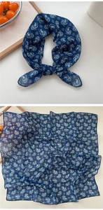 Detail of navy blue paisley cotton linen square scarf with semi-transparent texture