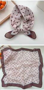 Macro detail of breathable cotton linen neckerchief with equestrian rider pattern